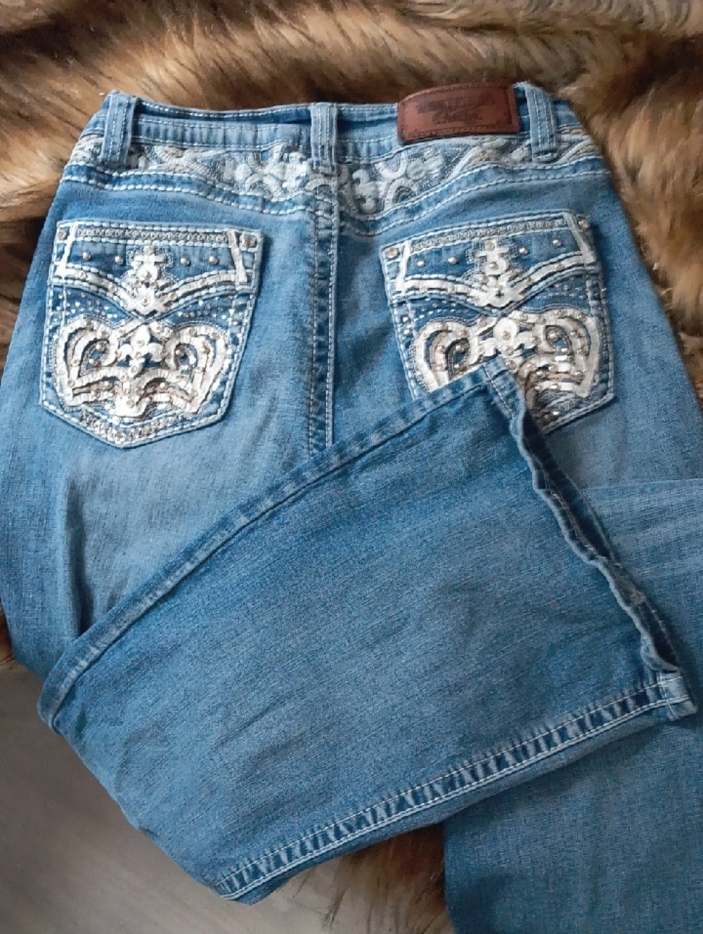 Embellished Light Blue Boyfriend Jeans with Decorative Back Pockets